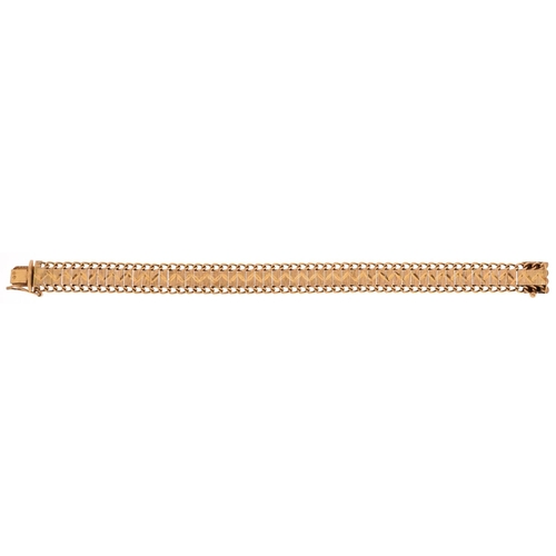 2001 - A continental yellow metal engine turned bracelet, tests as 14ct gold, 20cm in length, 22.3g.