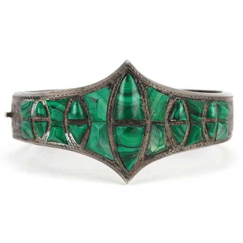 2207 - An antique unmarked silver and malachite hinged bangle with engraved floral decoration, 6cm wide, 25... 