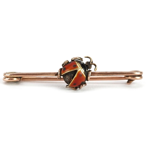 2386 - A 9ct rose gold enamel brooch in the form of a ladybird set with a diamond, 4.5cm wide, 4.0g.