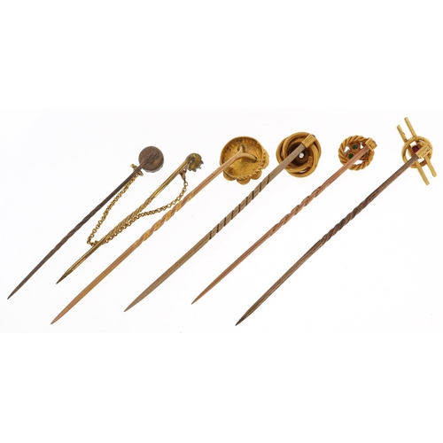 2369 - Five antique and later gold and yellow metal stick pins set with assorted stones including diamond, ... 