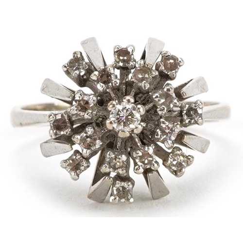 2003 - An 18ct white gold diamond starburst three tier cluster ring, size L, 4.7g.