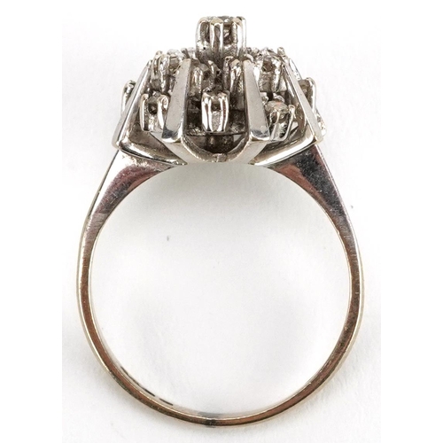 2003 - An 18ct white gold diamond starburst three tier cluster ring, size L, 4.7g.