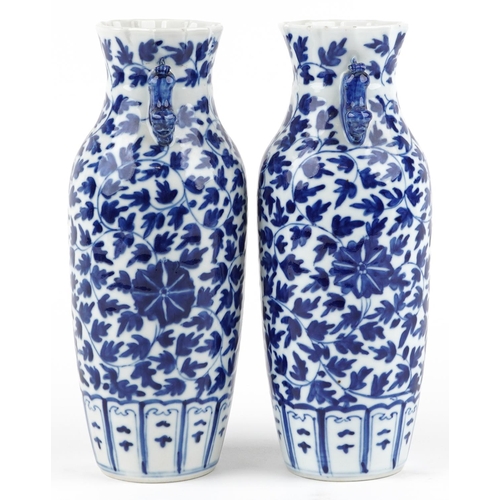 263 - A pair of Chinese blue and white porcelain vases, late 19th/early 20th century, with overall floral ... 