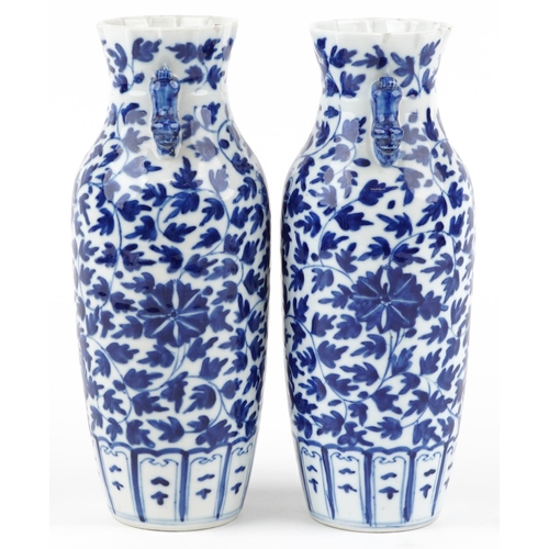 263 - A pair of Chinese blue and white porcelain vases, late 19th/early 20th century, with overall floral ... 