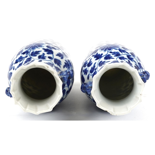 263 - A pair of Chinese blue and white porcelain vases, late 19th/early 20th century, with overall floral ... 