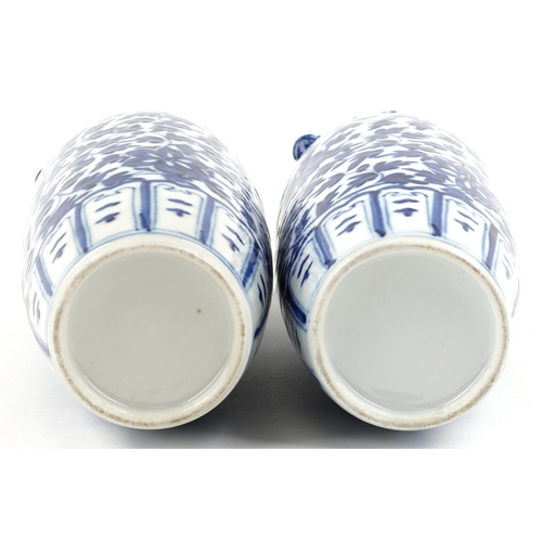 263 - A pair of Chinese blue and white porcelain vases, late 19th/early 20th century, with overall floral ... 