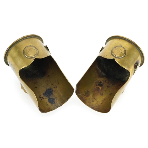 722 - Two similar early/mid 20th century Trench art and Zeppelin shell cartridge ashtrays, 12cm high.