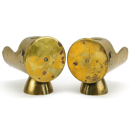 722 - Two similar early/mid 20th century Trench art and Zeppelin shell cartridge ashtrays, 12cm high.