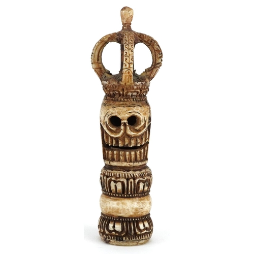 225 - An African carved bone ceremonial seal, 20th century, 16cm high.