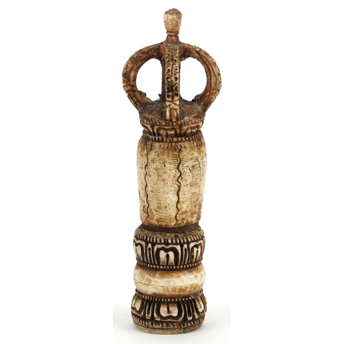 225 - An African carved bone ceremonial seal, 20th century, 16cm high.