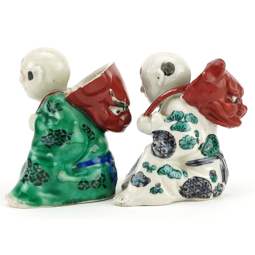 246 - A pair of Chinese hand painted porcelain figures, 20th century, 9cm high.