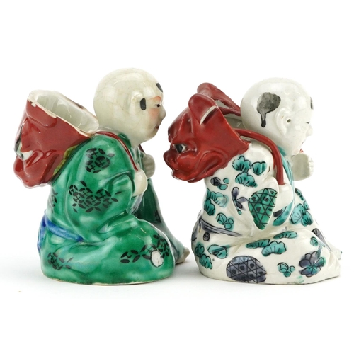 246 - A pair of Chinese hand painted porcelain figures, 20th century, 9cm high.