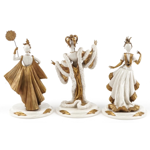 428 - Three partially gilt Capodimonte figurines of burlesque dancers, the largest 33cm high.