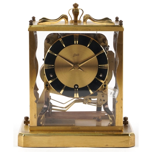 111 - A Schatz German brass and Perspex anniversary mantle clock, with black enamelled dial, raised on pli... 