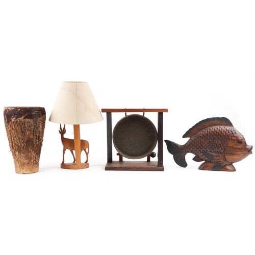 1172 - A 20th century African cowhide drum, 35cm high, together with a table lamp base modelled as an ibex,... 