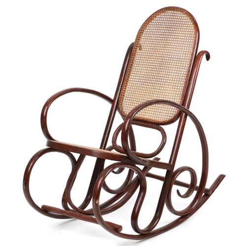 1049 - A mid 20th century bentwood rocking armchair with cane seat and back, possibly by Thonet, Austria, 1... 