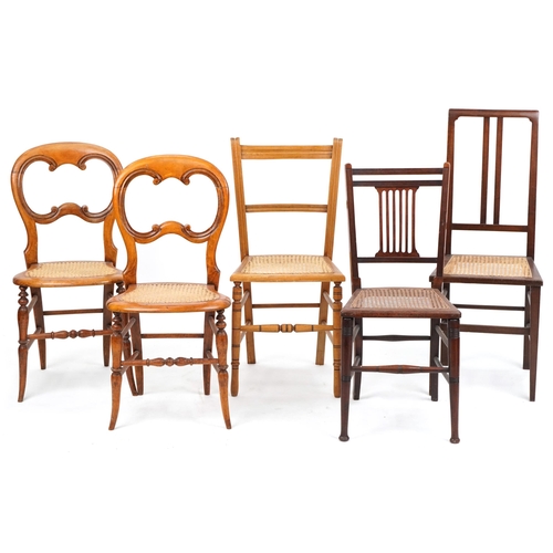 1050 - A pair of early 20th century beech framed bedroom chairs with cane seats together with three other c... 