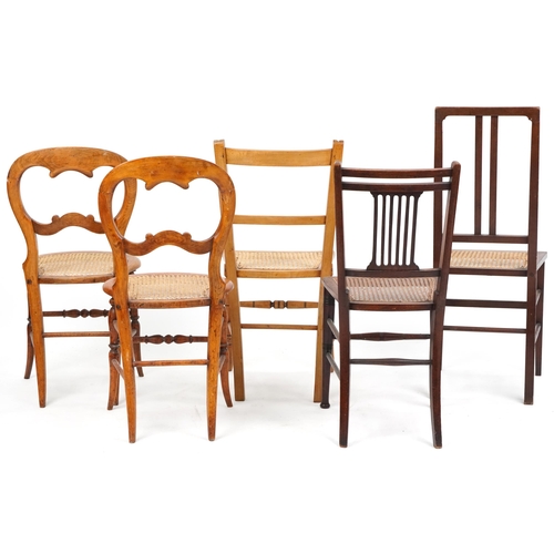 1050 - A pair of early 20th century beech framed bedroom chairs with cane seats together with three other c... 