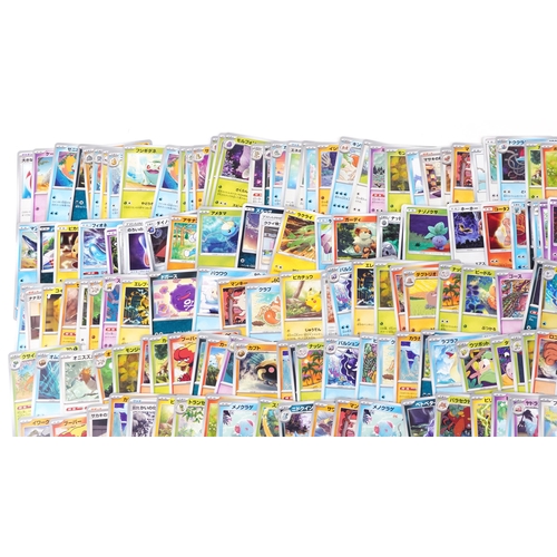 530 - A large collection of 2023 Japanese Pokémon trade cards, some holographic, approximately two hundred... 