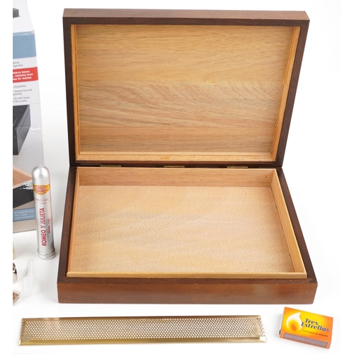 1179 - A TCM cigar humidor together with a similar cigar humidor, 29cm wide.