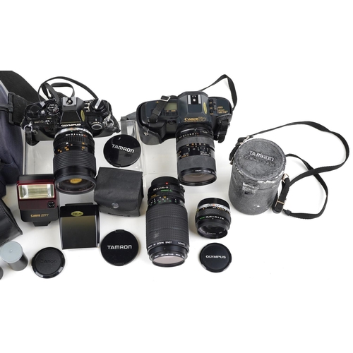 480 - A Olympus OM10 camera body together with a Hoya 62mm lens, a Canon zoom lens 75-200mm, a Canon T70 c... 