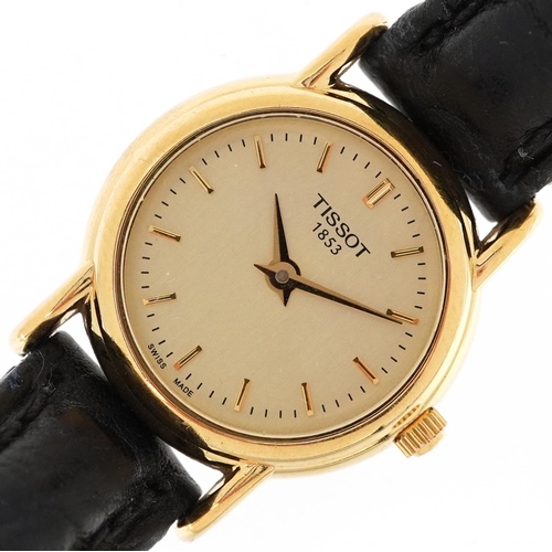 2571 - A Tissot 18ct gold cased ladies wristwatch with black leather strap, the dial 2cm in diameter, boxed... 