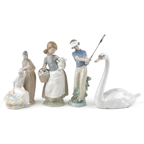 420 - Two Lladro figures together with two Nao figures, the largest 24cm high.