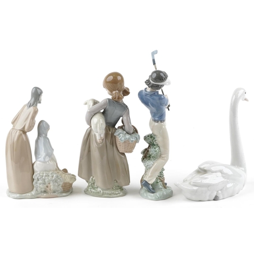 420 - Two Lladro figures together with two Nao figures, the largest 24cm high.