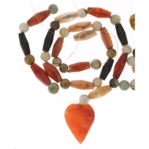 2573 - A polished hardstone necklace with heart shaped pendant.