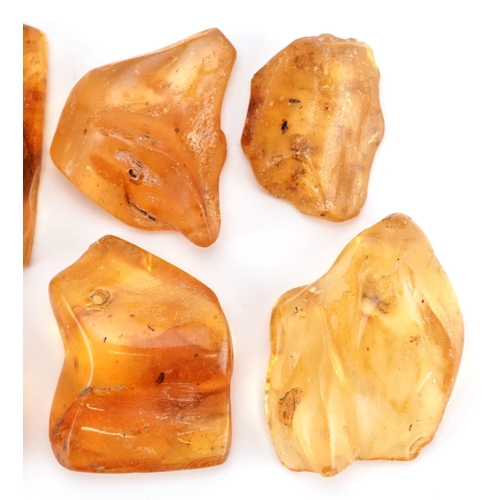 1274 - A group of six rough cut translucent amber shards, the largest 5cm in length