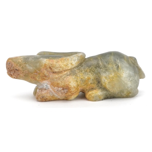 52 - A Chinese celadon and russet jade carving, possibly 18th century, in the form of a reclining water b... 