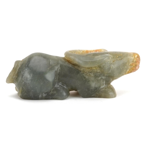 52 - A Chinese celadon and russet jade carving, possibly 18th century, in the form of a reclining water b... 