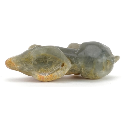 52 - A Chinese celadon and russet jade carving, possibly 18th century, in the form of a reclining water b... 