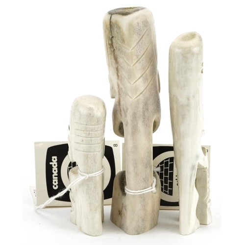 223 - A group of three Arctic Canadian carved bone totem figures by Gideon Taqaqiq, late 19th/early 20th c... 