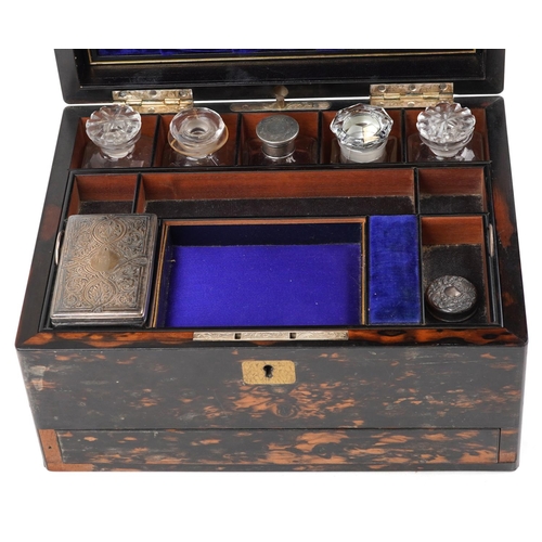 19 - A 19th century coromandel workbox with fitted interior, glass bottles, two with silver lids and secr... 