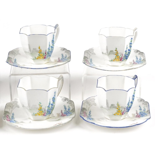 412 - A set of six Art Deco Shelley cups and saucers, each hand painted with flowers, pattern number 11606... 