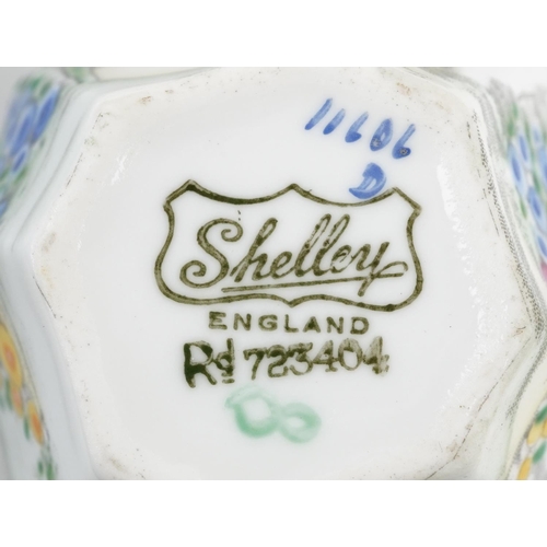 412 - A set of six Art Deco Shelley cups and saucers, each hand painted with flowers, pattern number 11606... 