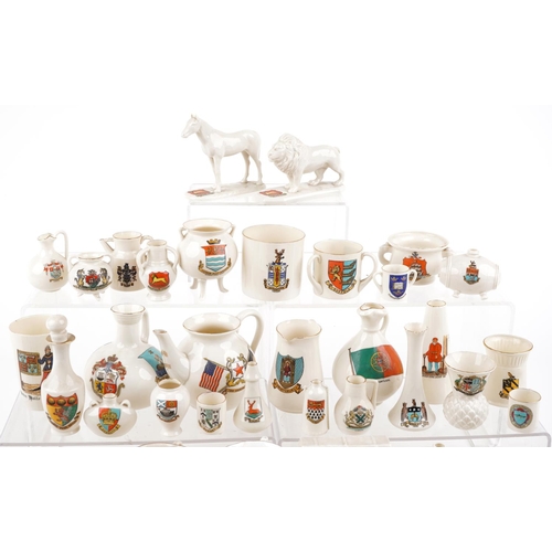 1305 - An extensive collection of predominantly W H Goss crested china.