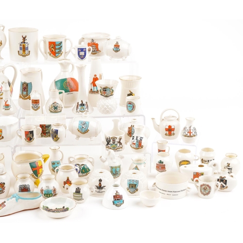 1305 - An extensive collection of predominantly W H Goss crested china.