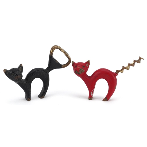 37 - A vintage Austrian bronze bottle opener and corkscrew in the form of cats, the largest 9cm in length... 