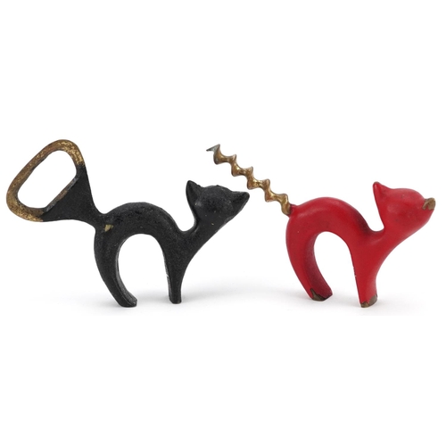 37 - A vintage Austrian bronze bottle opener and corkscrew in the form of cats, the largest 9cm in length... 