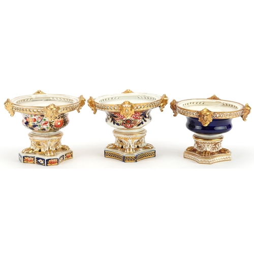 75 - Three 19th century Derby hand painted porcelain pot pourri vases, each lacking a cover, 10cm high