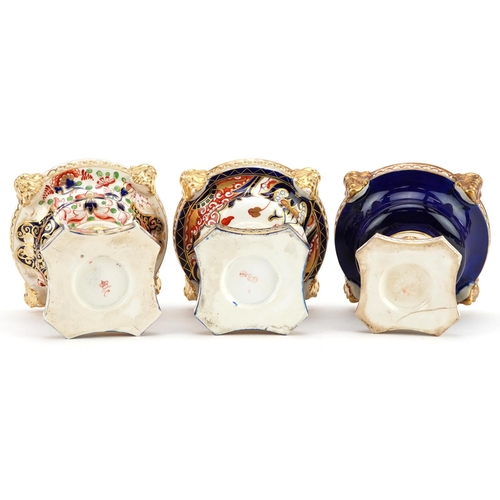 75 - Three 19th century Derby hand painted porcelain pot pourri vases, each lacking a cover, 10cm high