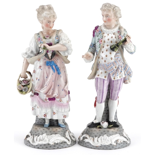 72 - A pair of late 19th century continental hand painted porcelain figures, marks to base, baring blue c... 