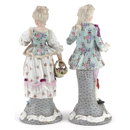 72 - A pair of late 19th century continental hand painted porcelain figures, marks to base, baring blue c... 