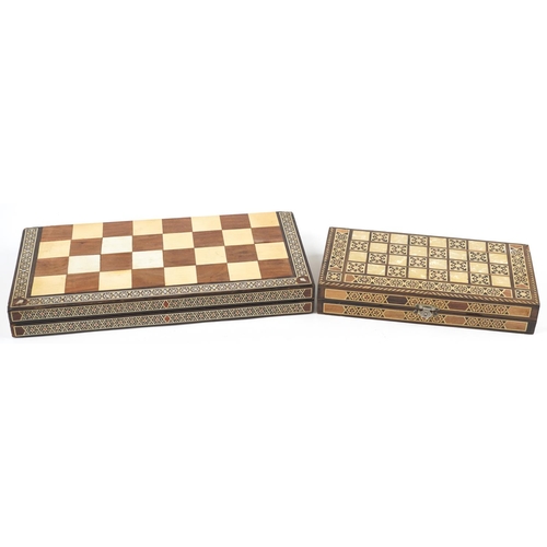 523 - A 20th century hardwood and inlaid folding chequer board, 47cm wide together with a similar smaller ... 