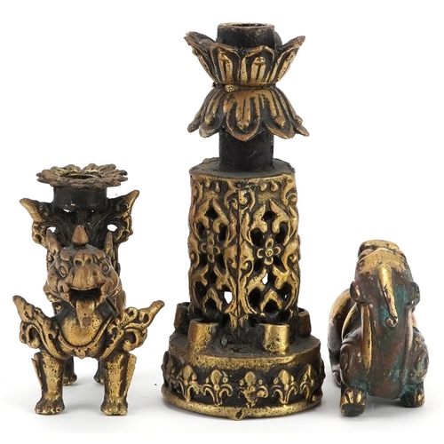 1195 - A group of three Chinese gilt bronze items, 20th century, including a temple dog and two candlestick... 