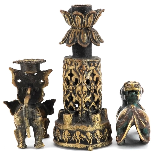 1195 - A group of three Chinese gilt bronze items, 20th century, including a temple dog and two candlestick... 