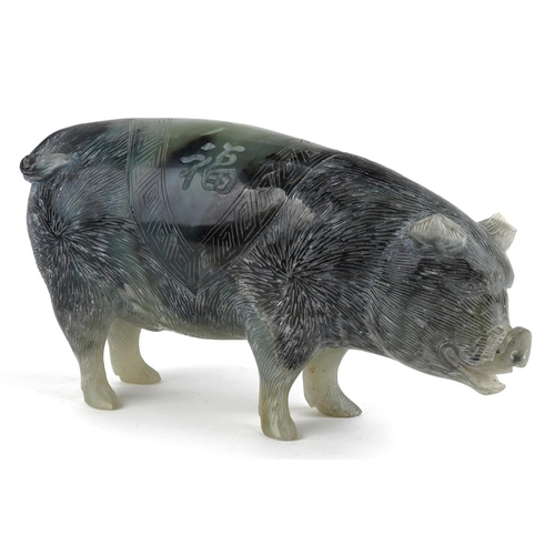 1325 - A Chinese carved hard stone figure of a standing pig, 20th century, bearing script, 12cm high x 23cm... 