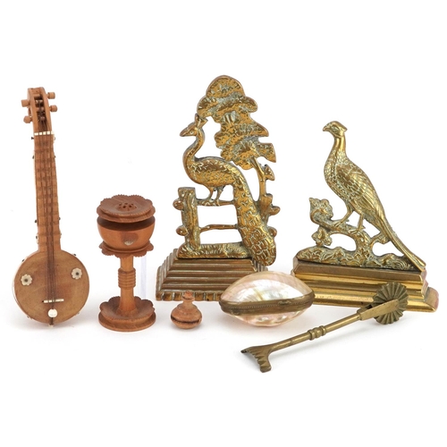 1335 - A small group of collector's items including a mother-of-pearl and brass box, a treen model of a sit... 